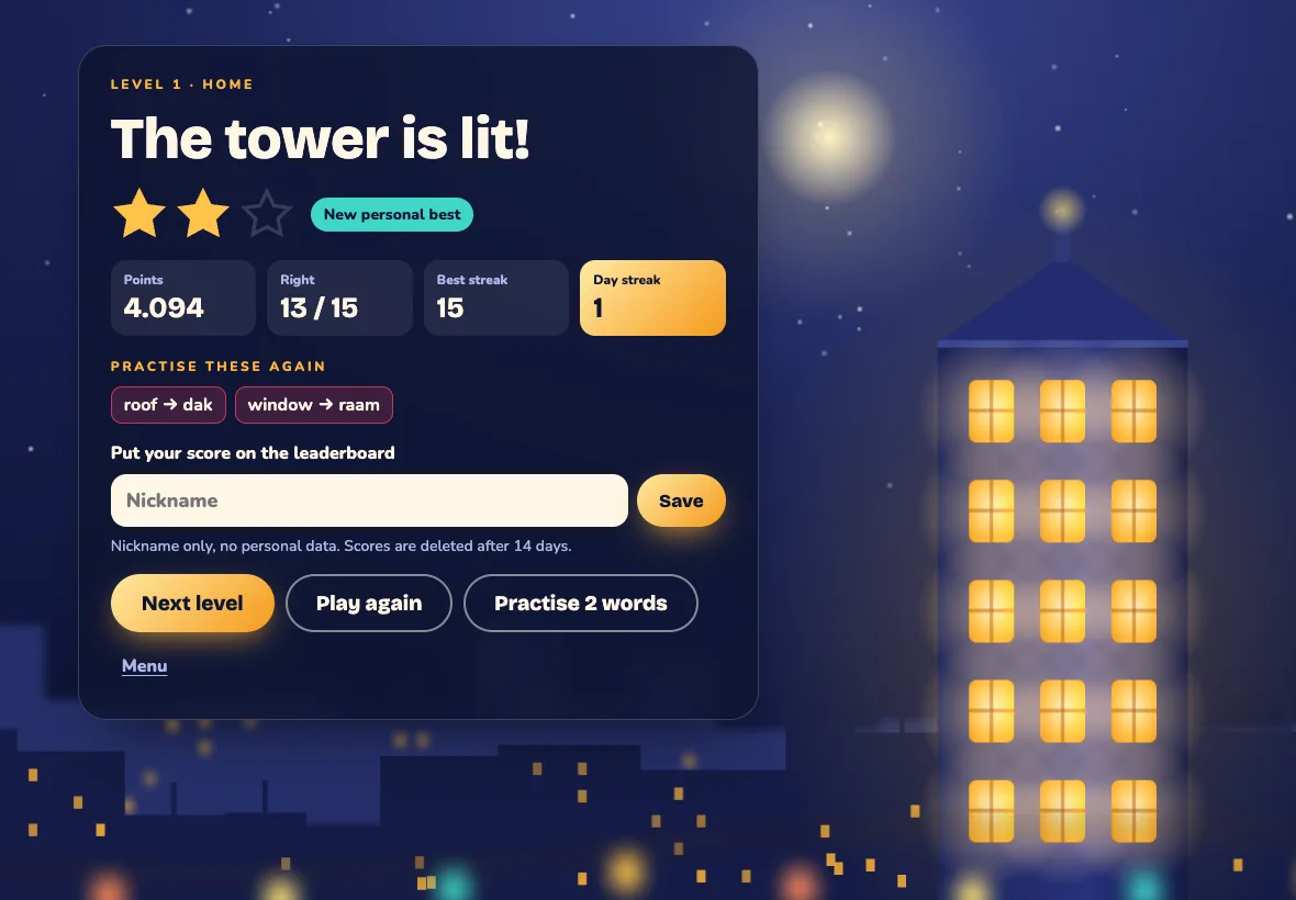 Level complete: the tower is lit, with stars, points and the words to practise